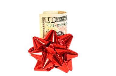 $10 bill with red bow