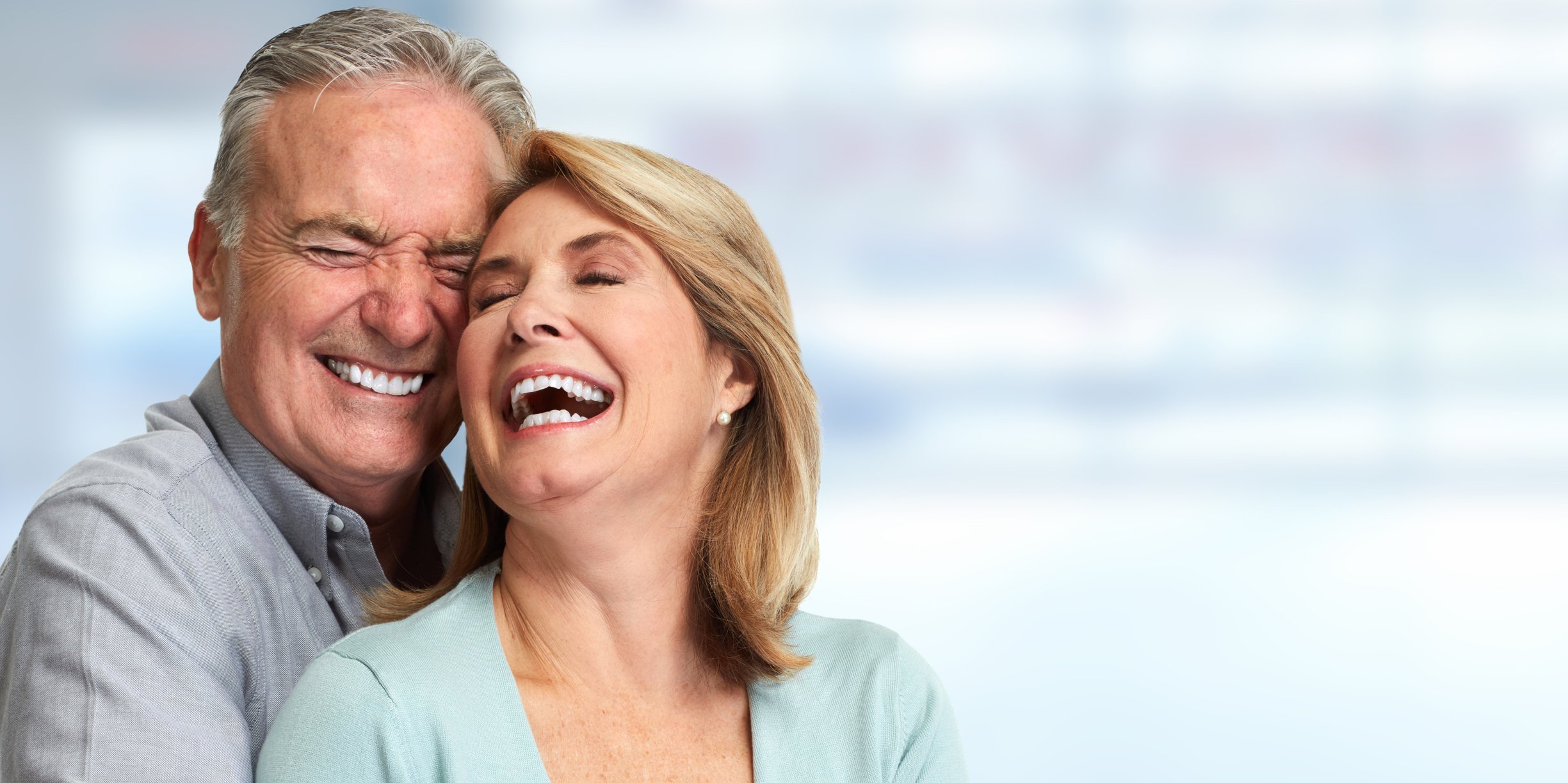 Older couple embracing and laughing