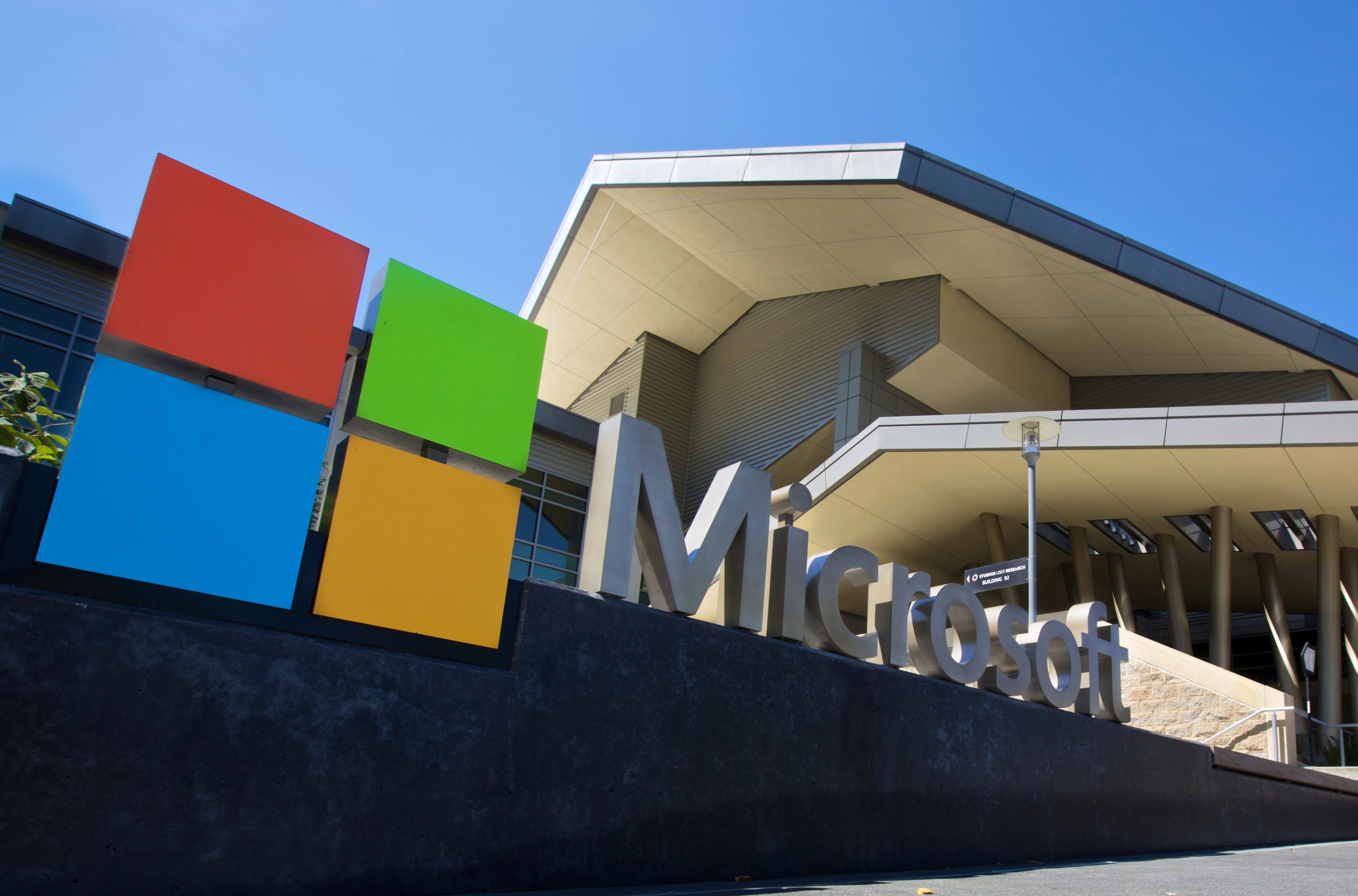 Microsoft logo sitting outside of a building.