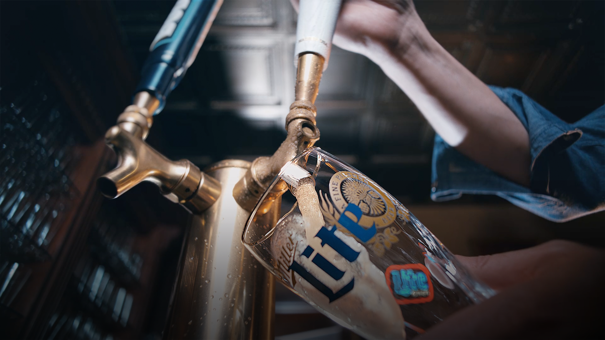 Pouring Miller Lite from tap into glass