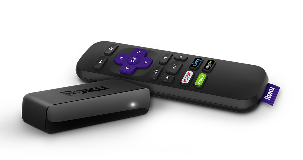 A Roku streaming player sitting next to a remote.