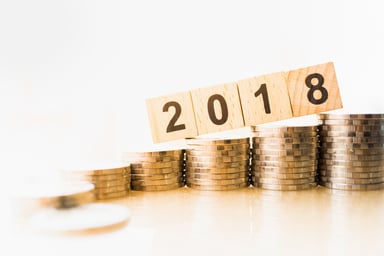 2018 on stacks of coins