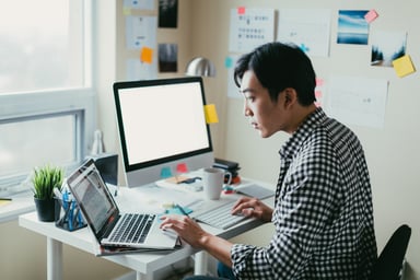man working at a computer_GettyImages-650066898