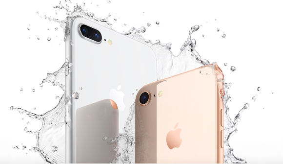 Two iPhone 8 devices are shown in an advertisement that features splashing water around the phones and a white background