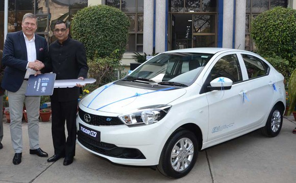 Tata Motors CEO Guenter Butschek handing over the keys of the Tigor EVs to Saurabh Kumar, Managing Director, EESL, an Indian Ministry of Power undertaking.