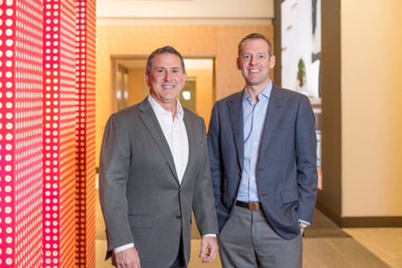 Target CEO Brian Cornell and Shipt CEO Bill Smith standing together in a hallway.