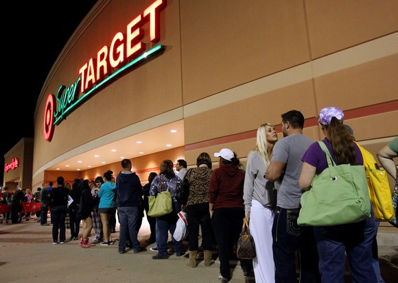 Customers line up for Black Friday outside of a Target store. 