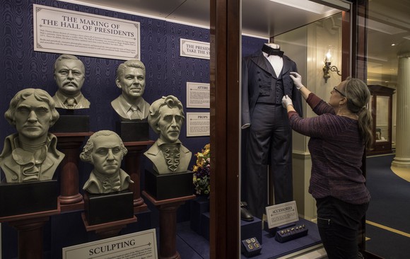 An exhibit outside of The Hall of President's theater detailing the history of the attraction.