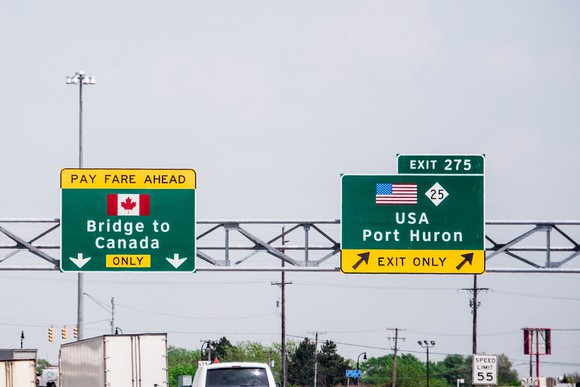 Highway signs to Canada and exit to USA