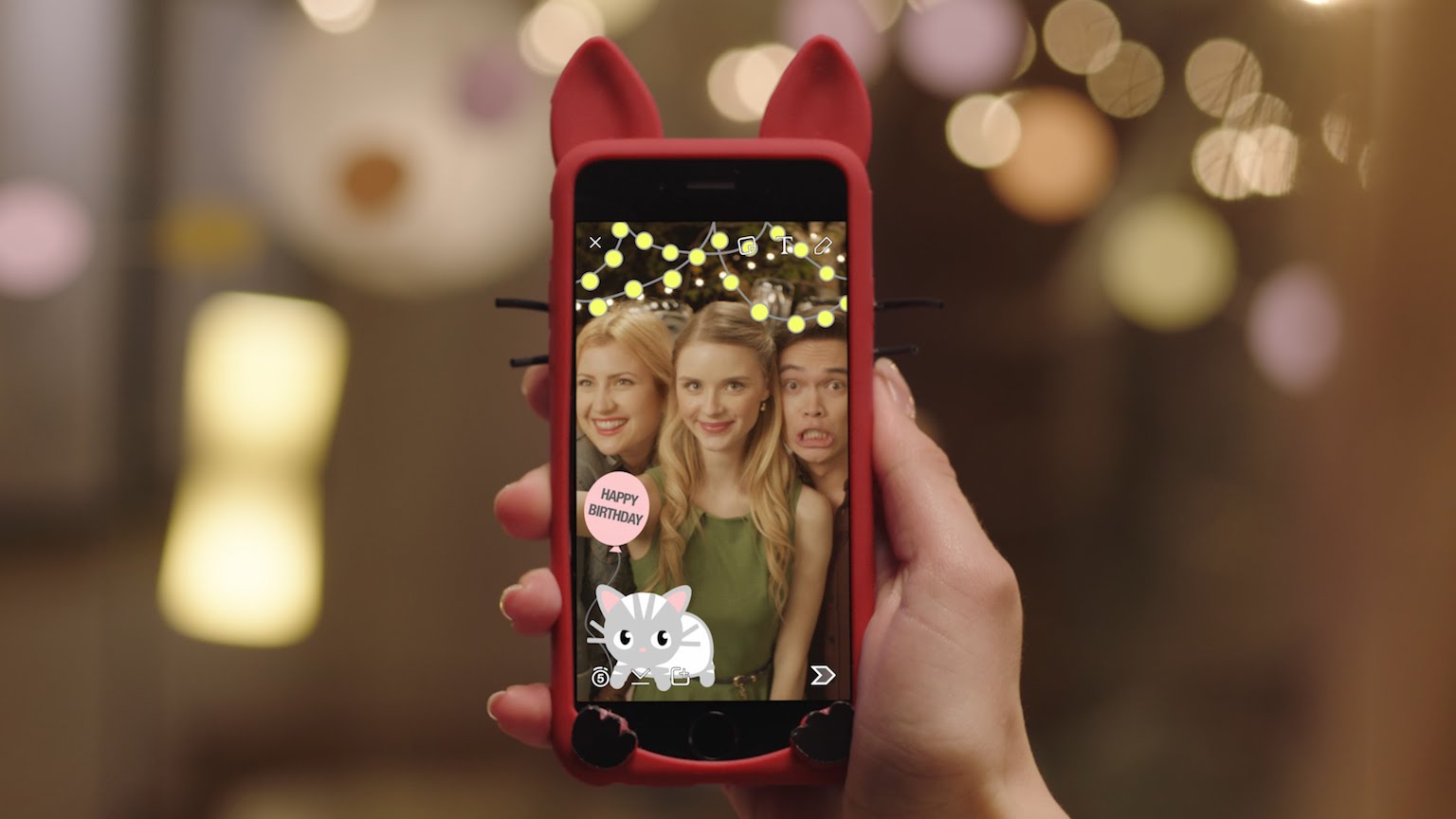 Snapchat's filters dolling up a holiday photograph on a smartphone.