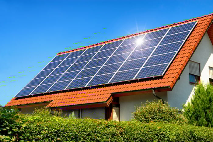 Sunlight reflecting off a large rooftop solar installation. 