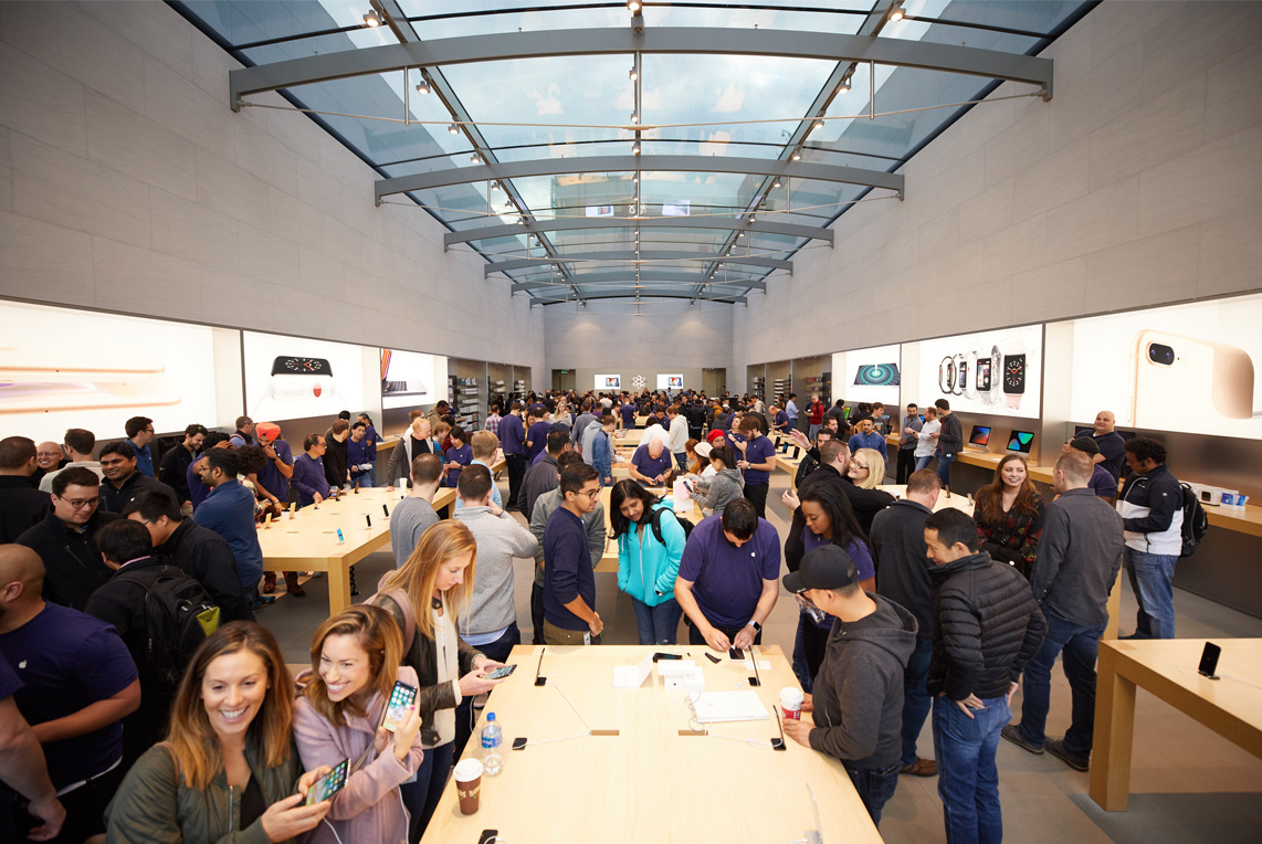 Apple store interior flooded with customers during iPhone X launch.