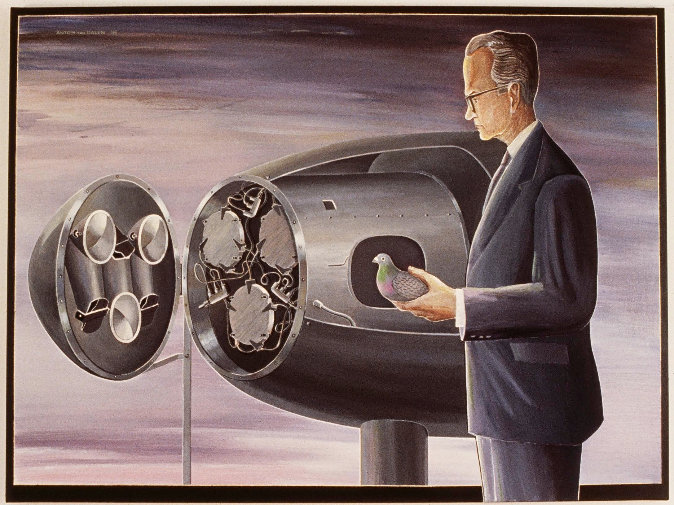 B.F. Skinner holding a pigeon next to a bomb with three miniature cockpits