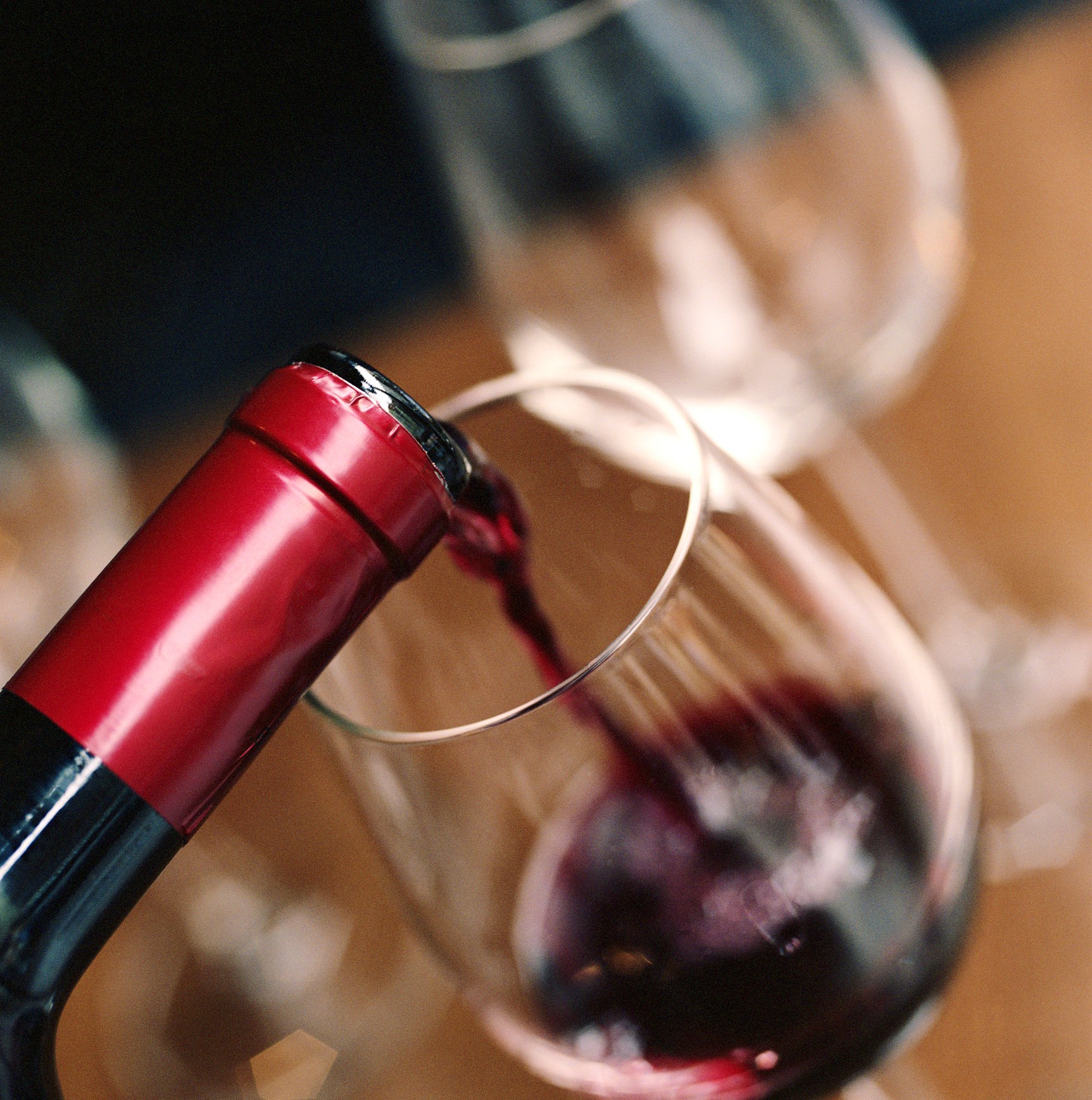 Red wine pouring into a glass.