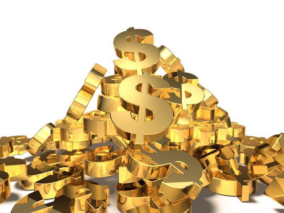 A pile of gold U.S. dollar signs.