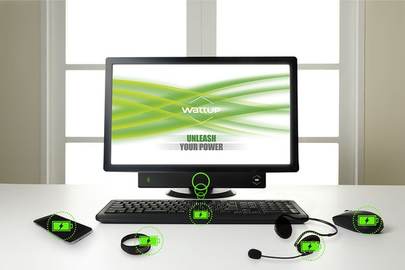 Illustration of Energous WattUp mid-field charging transmitter on multiple devices including a computer keyboard, smartphone, and mouse