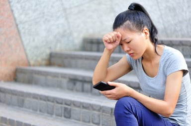 asian woman worry debt getty