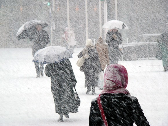 People walking in a snowstorm