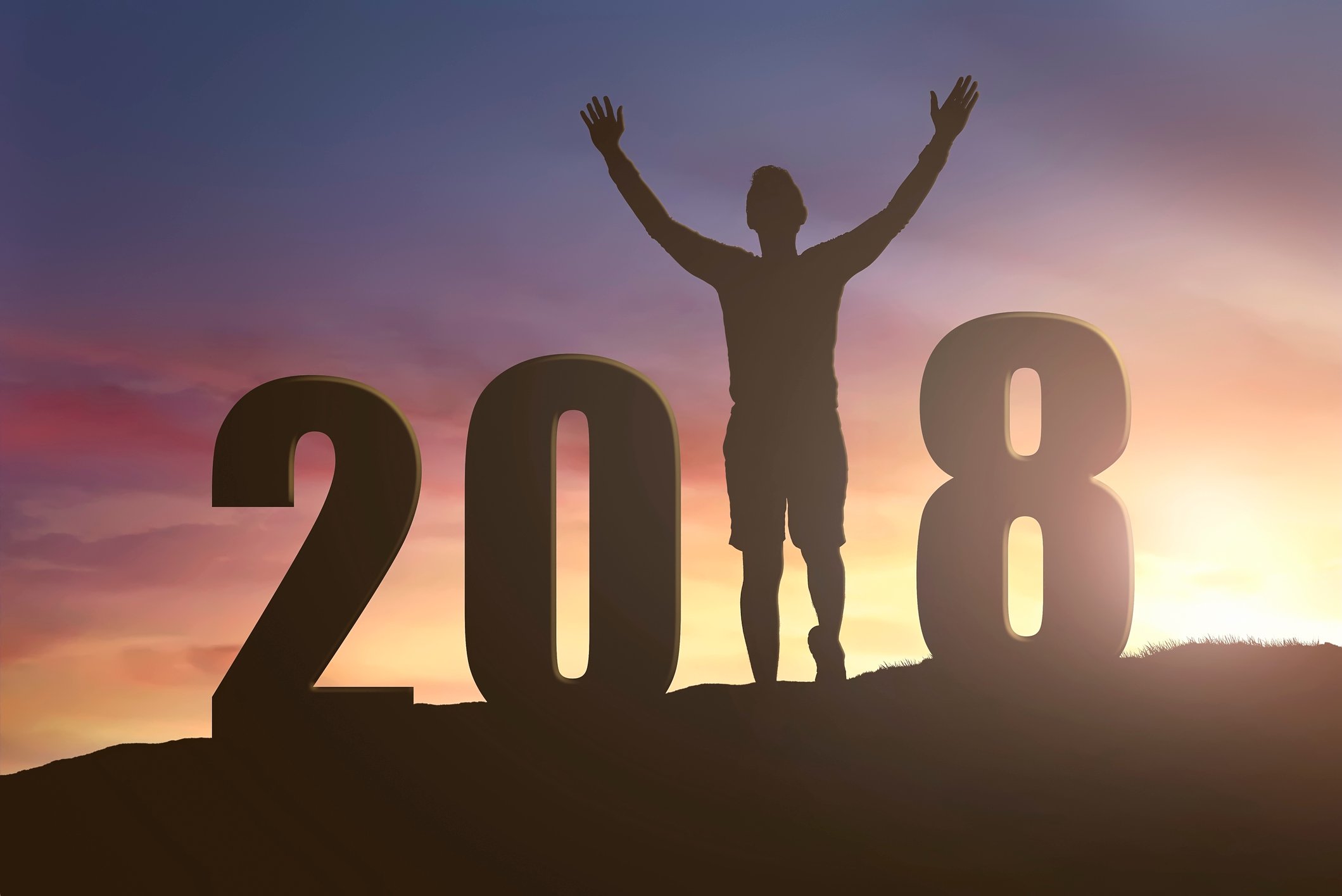 2018 silhouette with man holding arms up