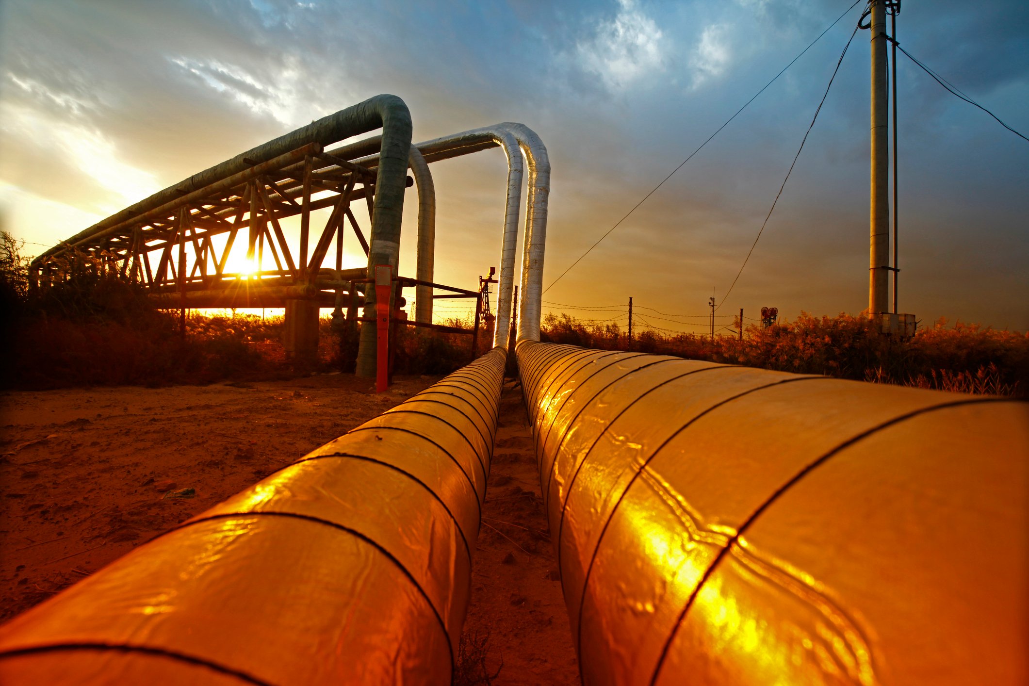 An energy pipeline at sunset.