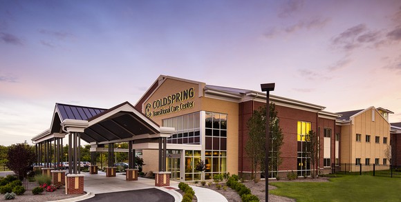 Coldspring Transitional Care Center facility under a clear sky near dusk.