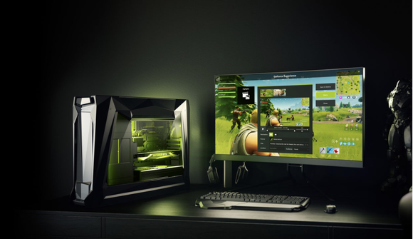 Desktop PC with a monitor displaying a game.