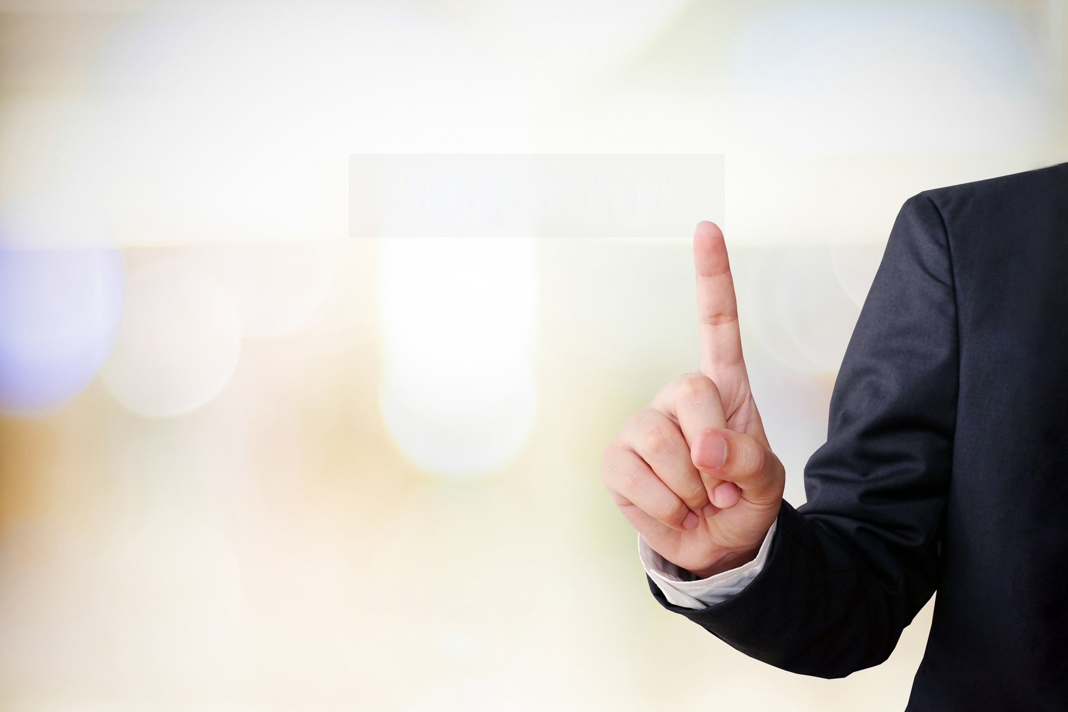 Businessman holding up index finger