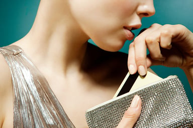 woman removing card from purse