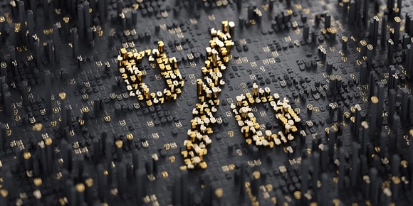 Percentage sign in raised gold mosaic against a gray background.