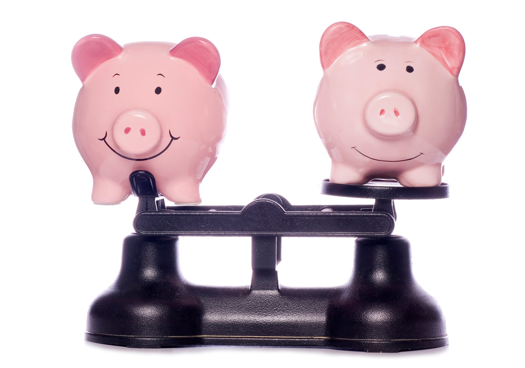 Two piggy banks on scales