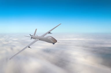 Drone Flying Above Clouds