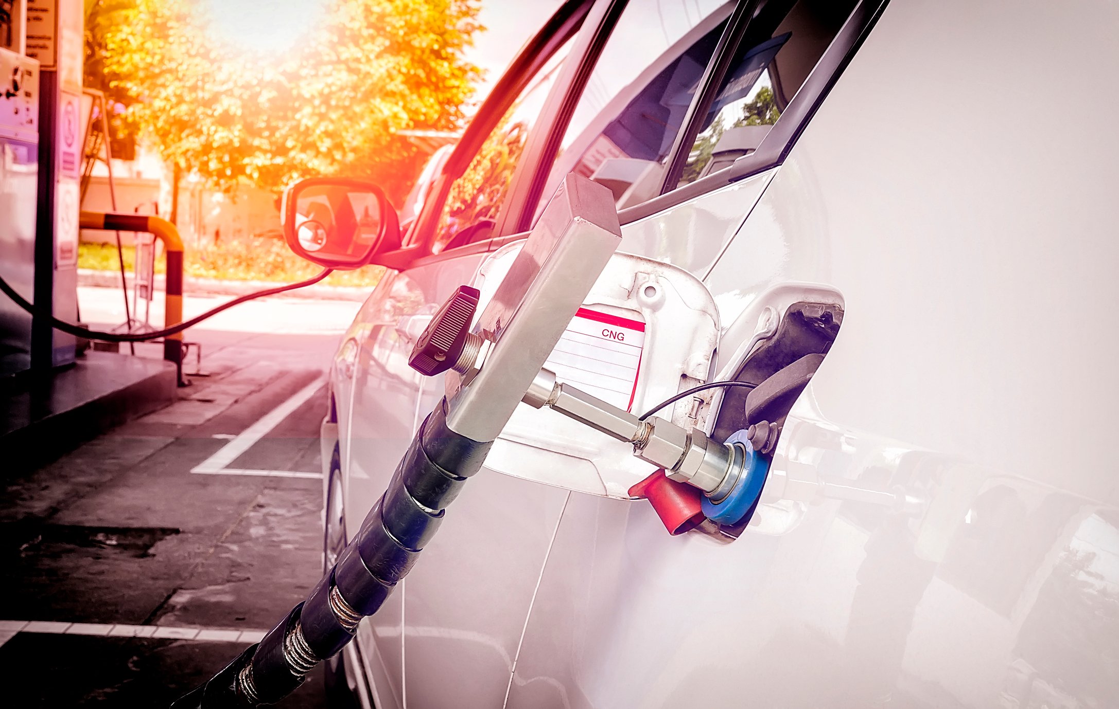 Car being filled with natural gas. 