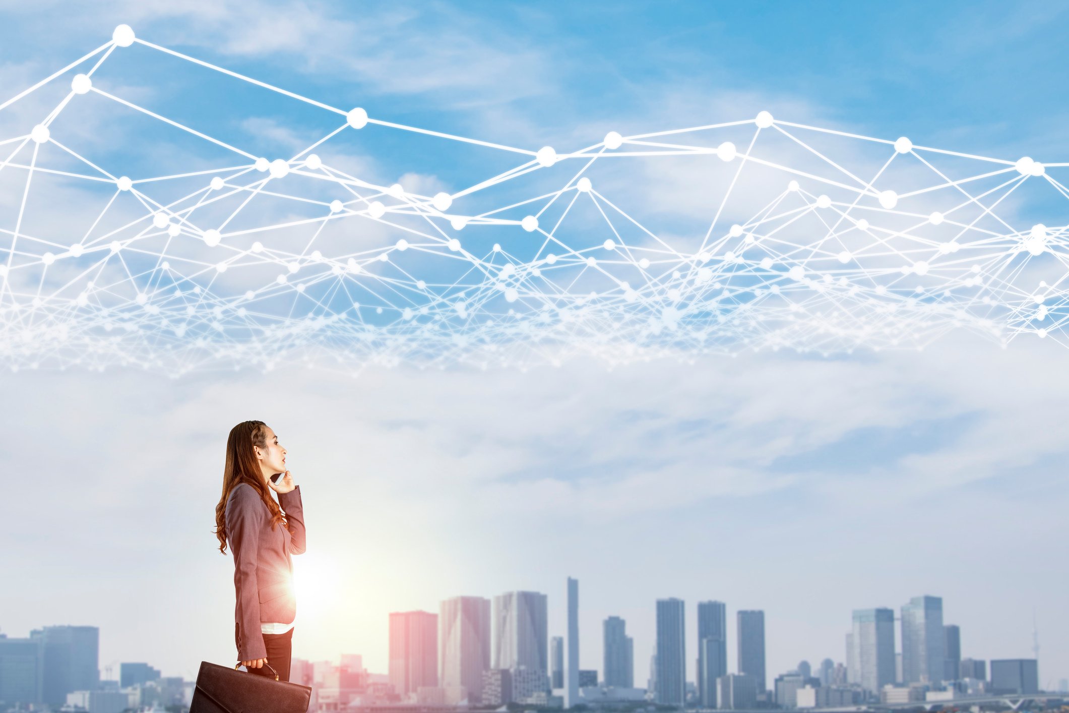Businesswoman gazes at a city skyline with a web of white lines interconnected above.
