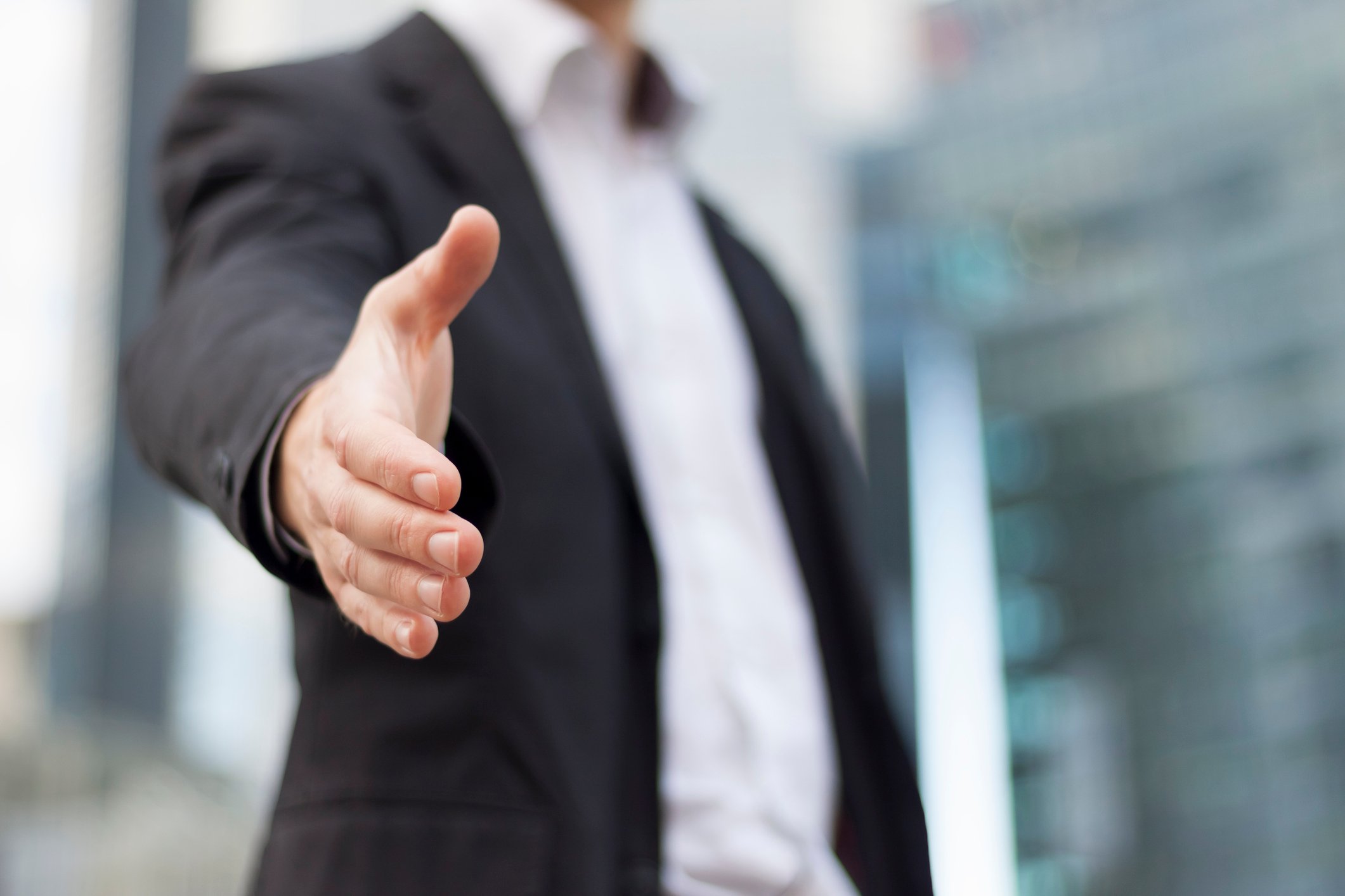 Professional extending a handshake