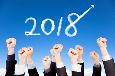 2018 in sky with fists raised