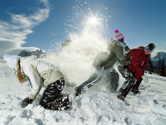 3 kids playing in the snow