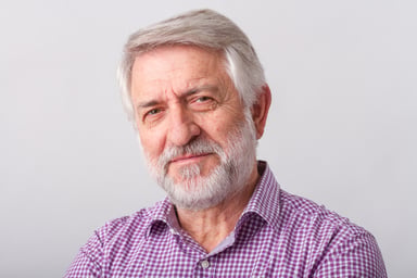 senior male smiling slighly_GettyImages-535464047