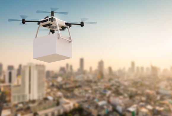 A delivery drone flying over a city.