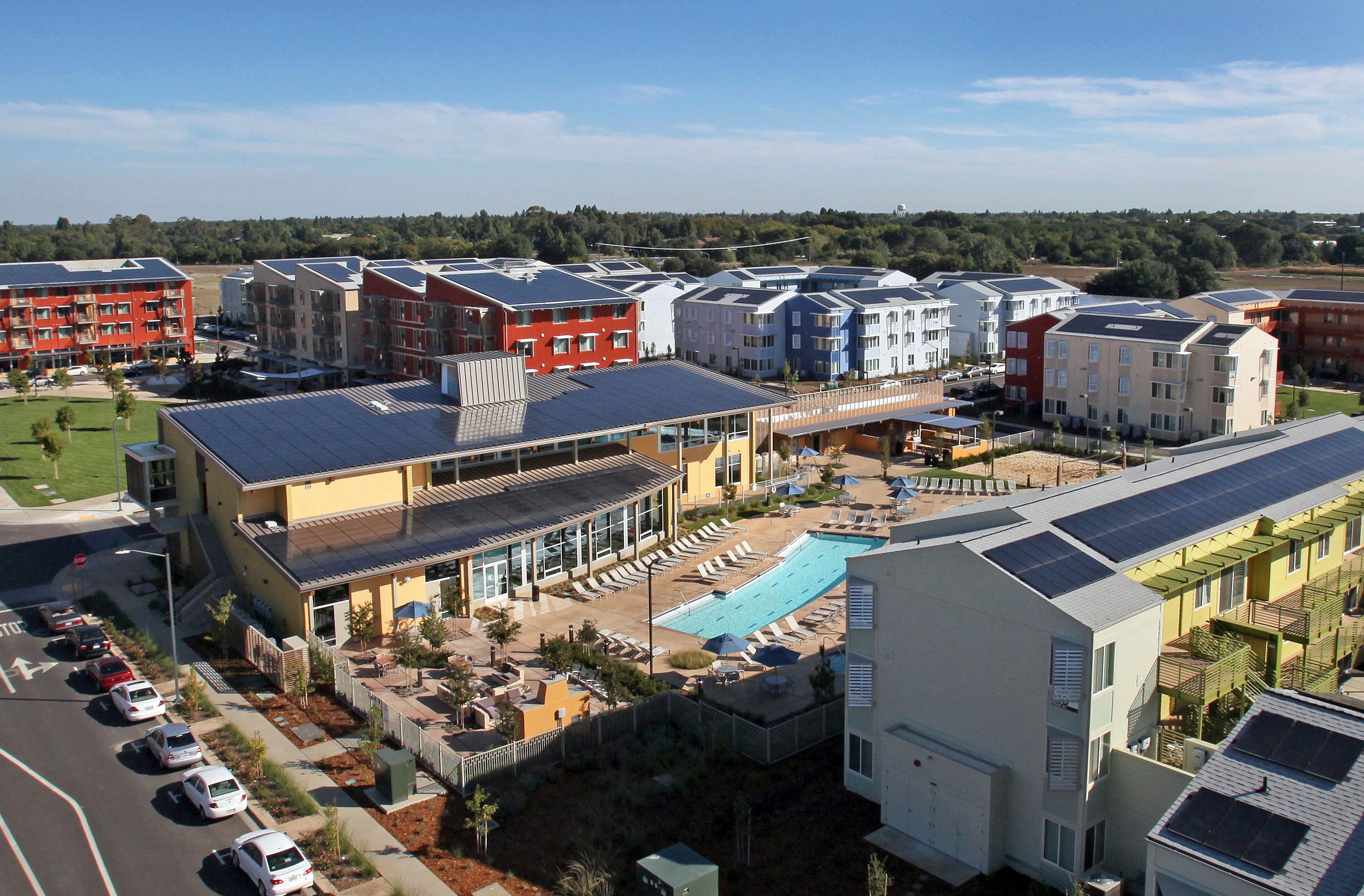 Community with solar panels on the roof. 