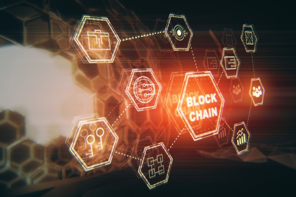 Several glowing hexagons containing icons, the largest of which says "blockchain"