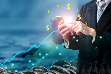 Chart going up with man holding calculator