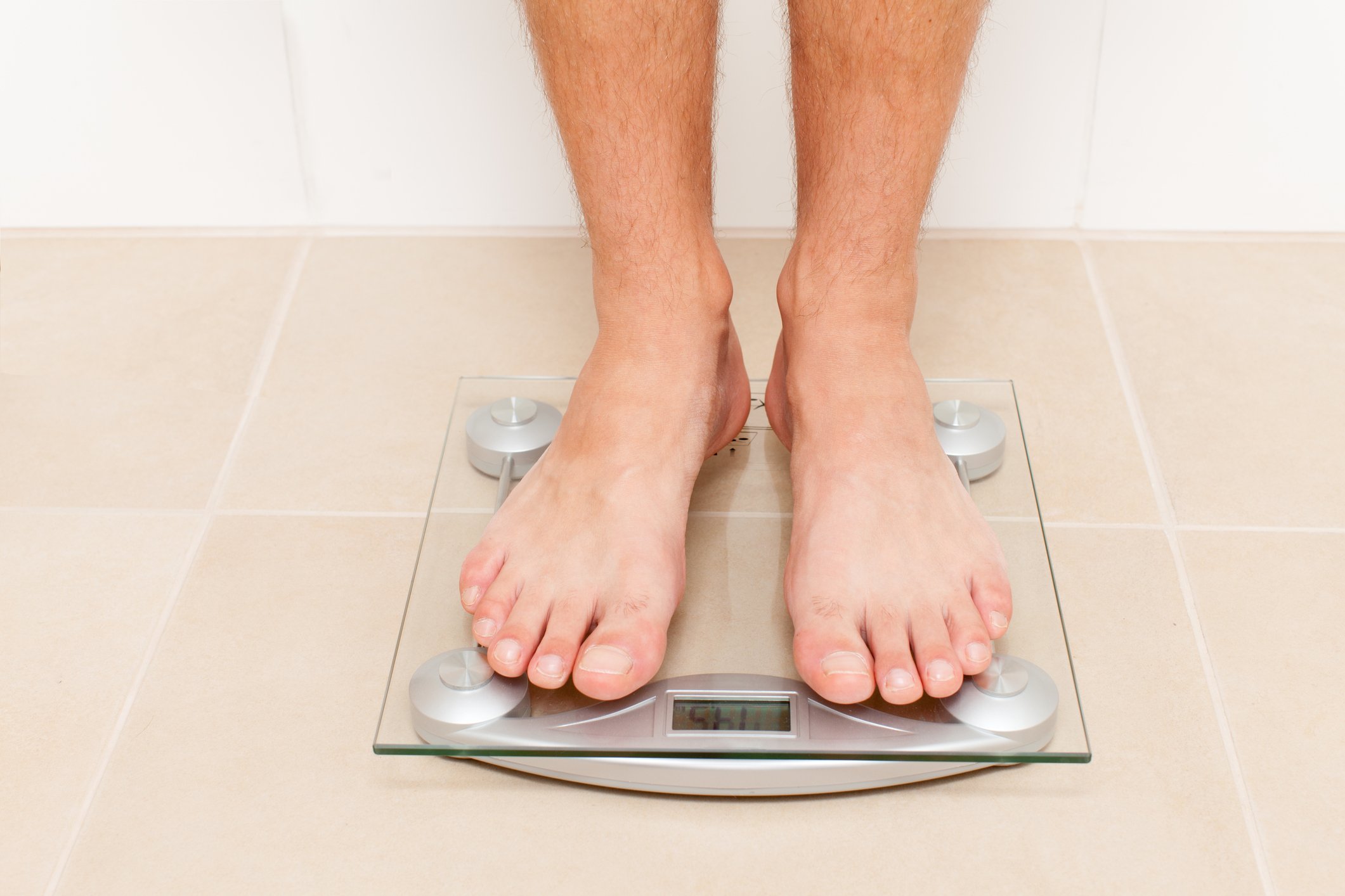 Man standing on a scale