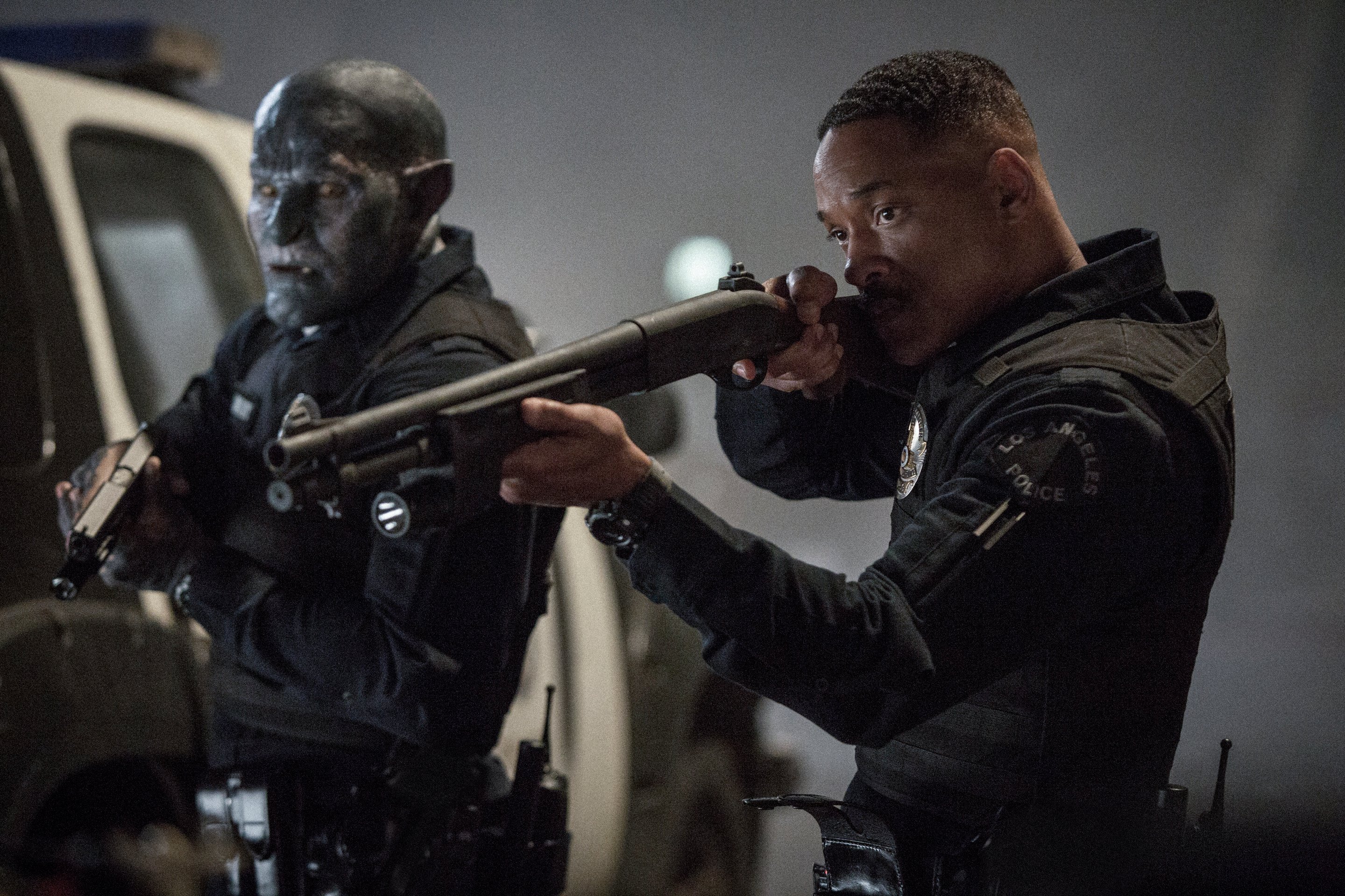 Will Smith and Joel Edgerton point shotguns in a scene from movie Bright.