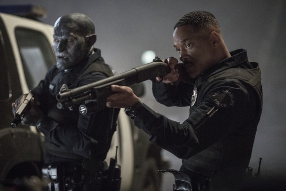 Will Smith and Joel Edgerton point shotguns in a scene from movie Bright.