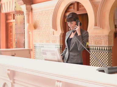 rsz_hotel_receptionist_talking_on_telephone