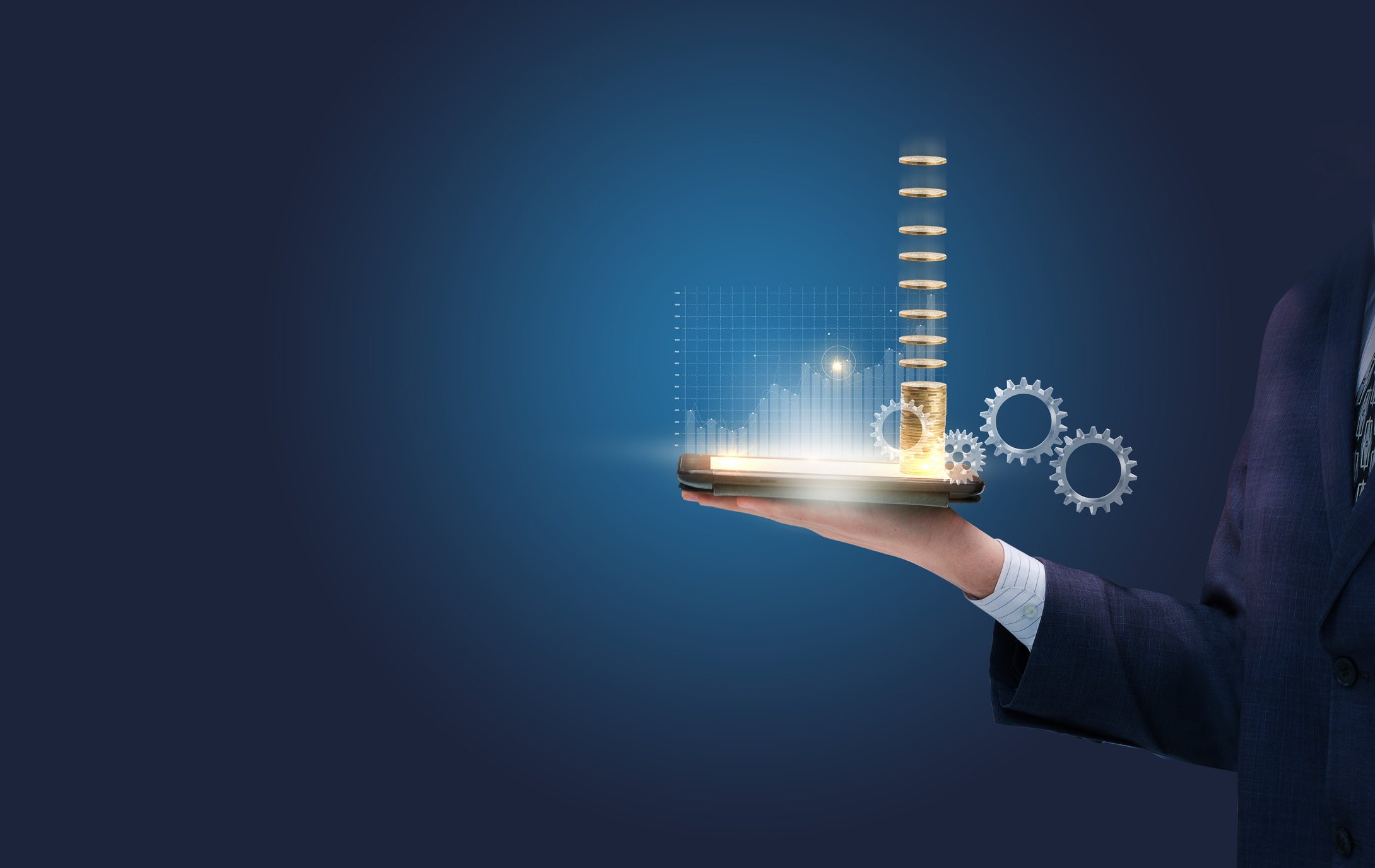 Person holding a tablet with a stack of gold coins on it.