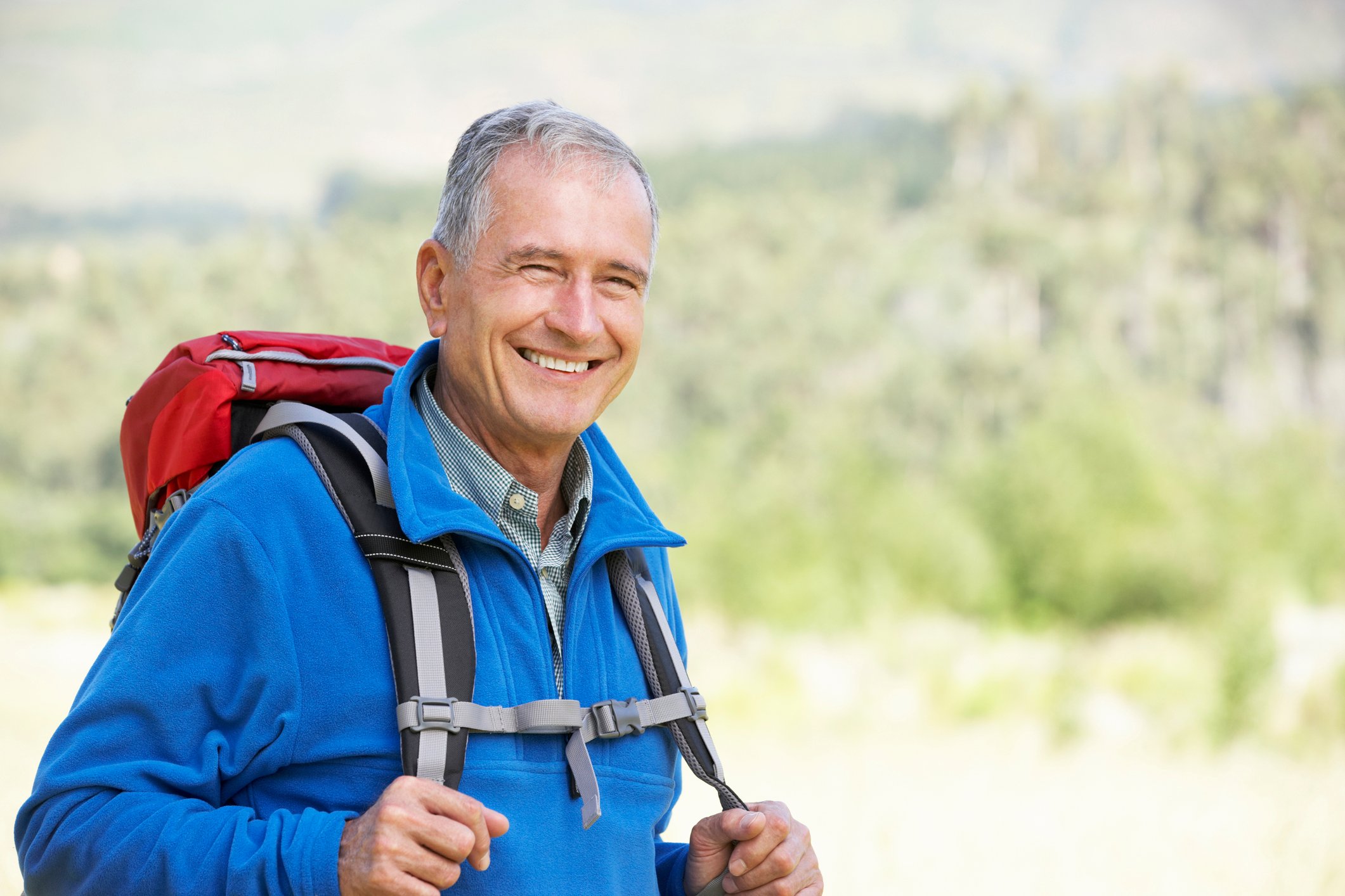 Senior man backpacking