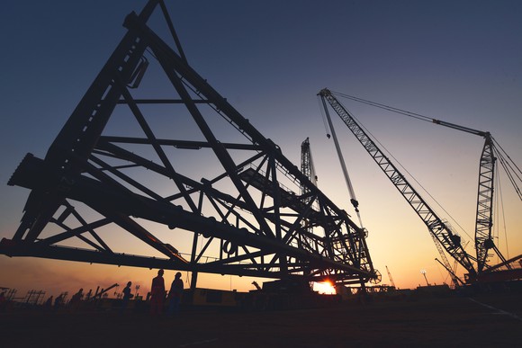 Assembling an offshore jacket at sunset.