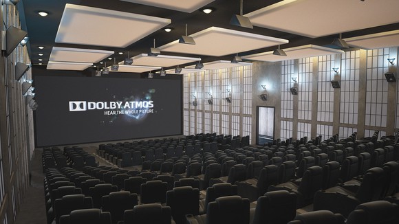 Empty Dolby Atmos theater with all lights on, speakers neatly lined up on ceiling and walls