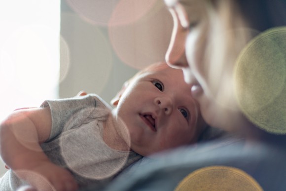 Woman holding newborn baby